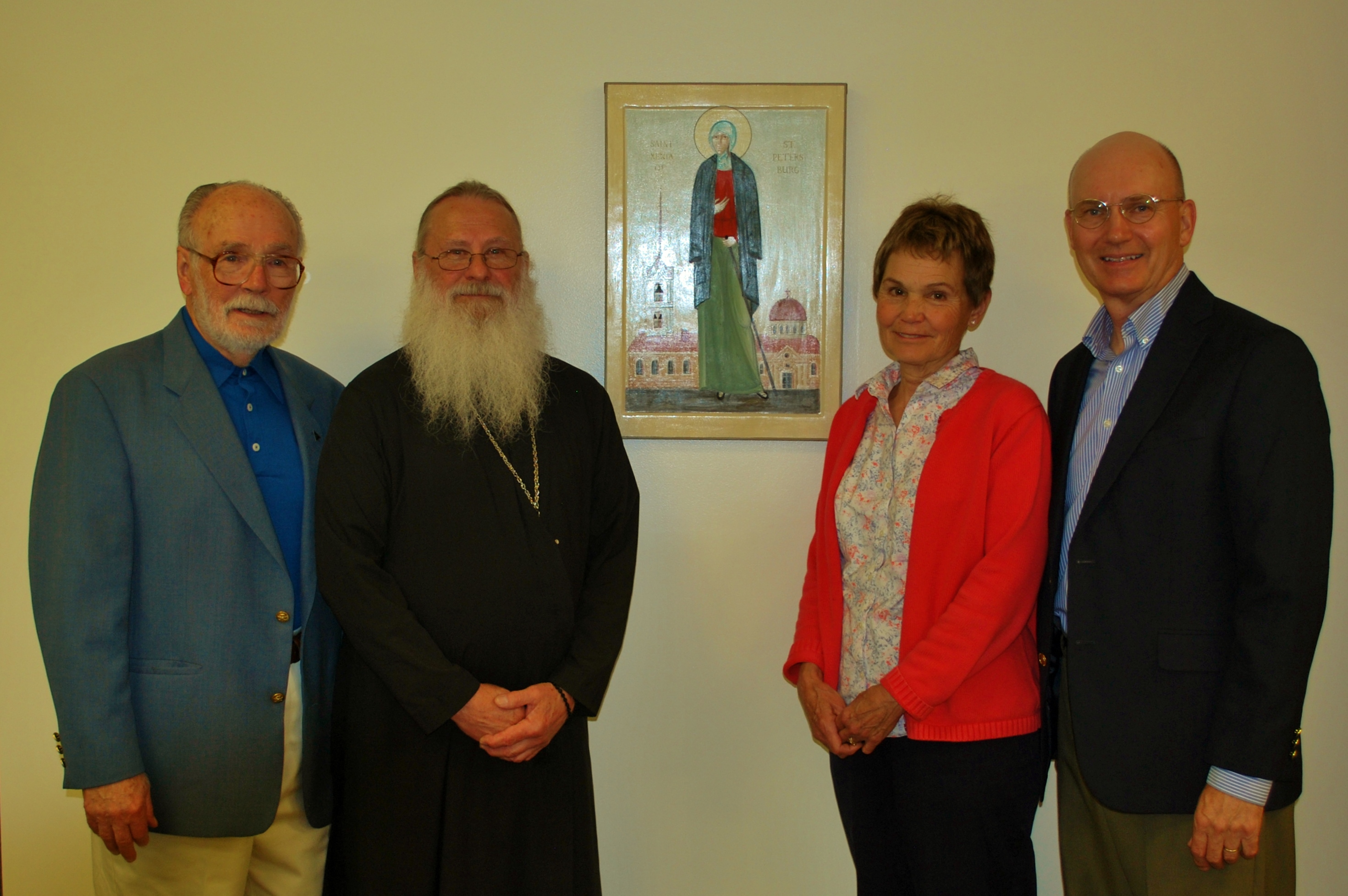 Left to Right: Don Nead, Father Gregory Allard, LUM Board President Joan Low, and Joe Micon, LUM executive director.